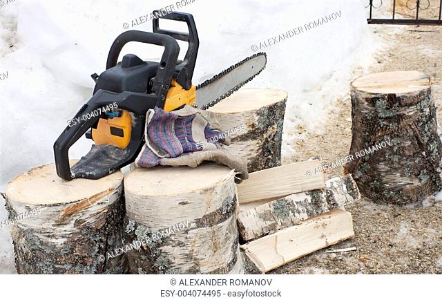 Firewood and chainsaw