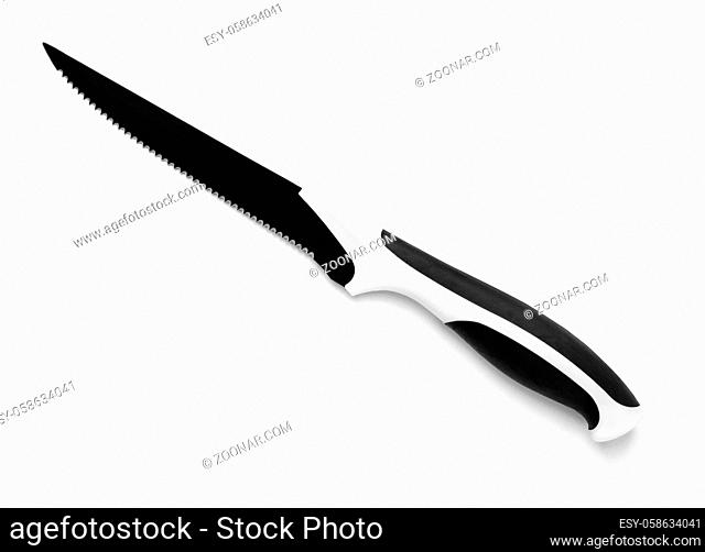 Black serrated utility kitchen knife isolated on white