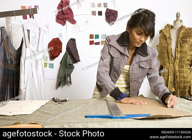 Indian female fashion designer in workshop