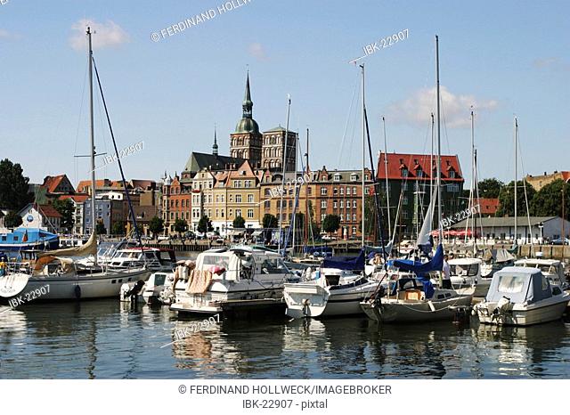 BRD Germany Mecklenburg Vorpommern City Stralsund Historical Houses in the Down Town and Nicolai Church View to Harbour and Sailboats