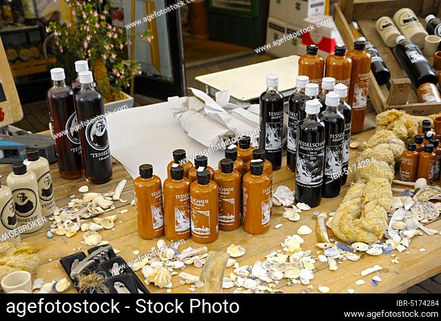 Market stall with typical liqueurs, shopping street, Den Burg, Texel Island, North Sea, North Holland, Netherlands