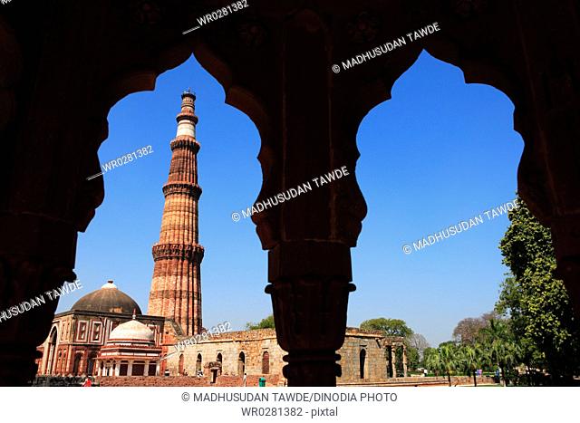 Alai Darwaza Imam Zamins tomb with Qutab Minar built in 1311 red sandstone tower , Delhi , India UNESCO World Heritage Site