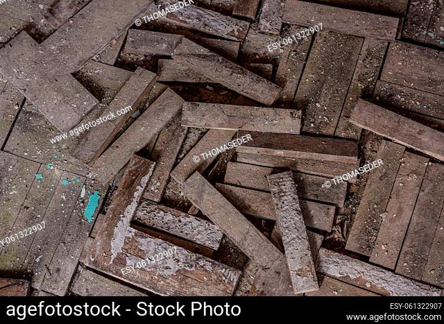 crumbled parquet floor in a abandoned house in the country