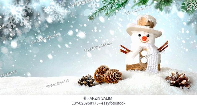 modern seasonal background in blue-green and white, with a cute happy snowman in the snow, perfect for christmas or winter season