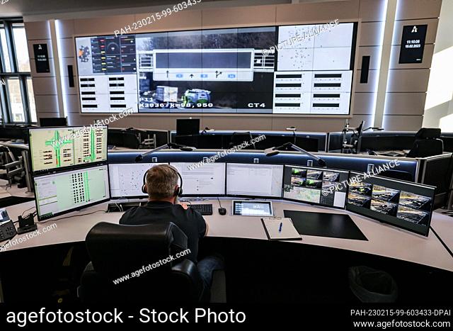 15 February 2023, North Rhine-Westphalia, Leverkusen: An employee sits in the control room of the traffic control center