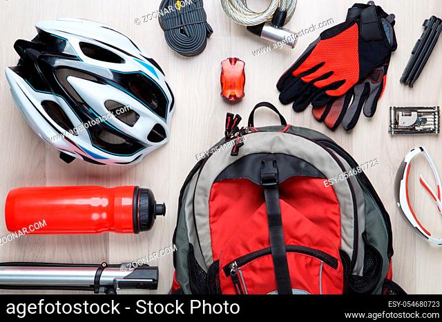 Picture top of biker accessories on empty wooden background