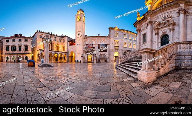 DUBROVNIK, CROATIA - JULY 1, 2014: Panorama of Luza Square and Sponza Palace in Dubrovnik. In 1979, the city of Dubrovnik joined the UNESCO list of World...