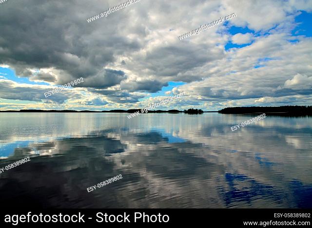 White nights at lake Keret, Mirror image. Northern Karelia, Russia