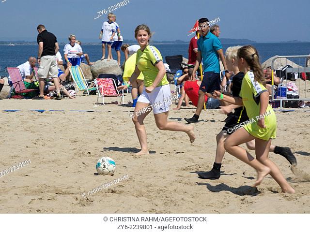 Players in mixed gender and age in the Family game series. Ahus Beach Soccer tournament 2014