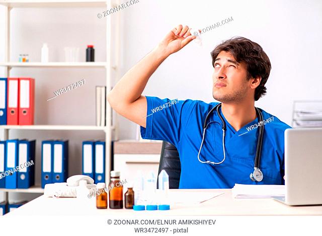 Young doctor working in the hospital