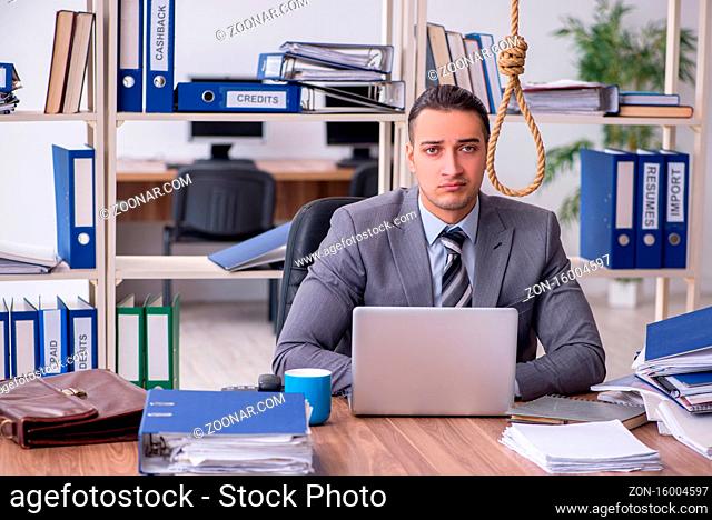 Young employee committing suicide at workplace