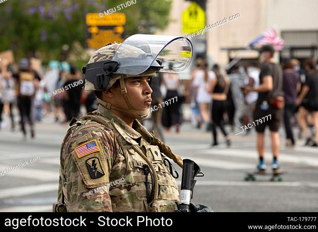 Los Angeles, CA - June 2, 2020: The National Guard watches protesters during the George Floyd Black Lives Matter Protest on June 2