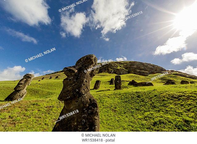 Moai sculptures in various stages of completion at Rano Raraku, the quarry site for all moai, Rapa Nui National Park, UNESCO World Heritage Site