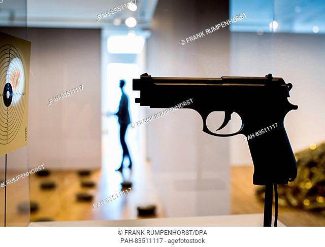 'Beretta Lamp, ' the lamp in the shape of a pistol by designer Raffaele Iannello can be seen during the press preview of the exhibition 'Under Arms: Fire...
