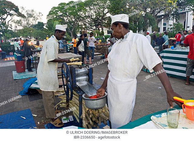Food vendors making sugarcane juice in Forodhani Gardens, Stone Town, Zanzibar, Tanzania, Africa