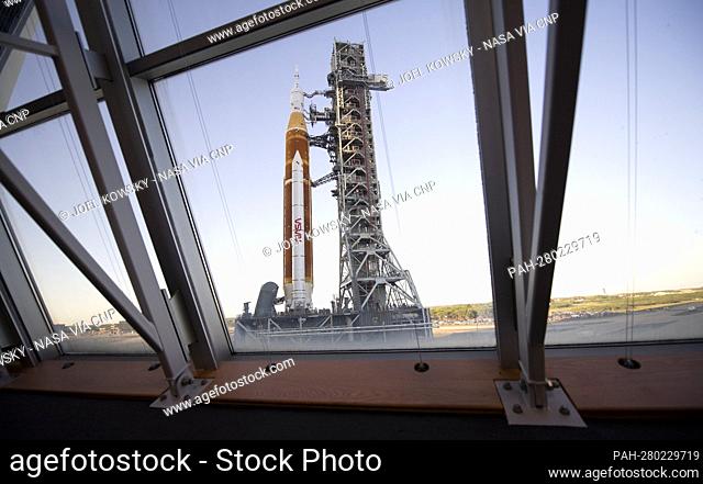 NASA’s Space Launch System (SLS) rocket with the Orion spacecraft aboard is seen through the windows of Firing Room One in the Rocco A