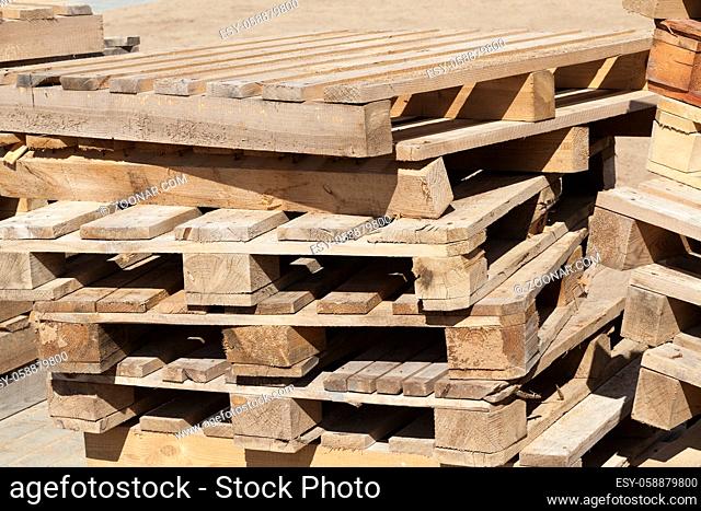 old empty wooden pallets from tiles, lie on construction site
