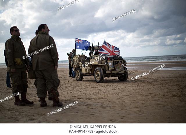Military enthusiasts arrive before the D-Day anniversary celebrations to indulge their hobby at Omaha Beach in Vierville Sur Mer, France, 04 June 2014