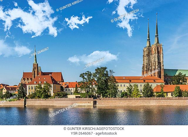 View over the river Oder to. the Cathedral Island (Ostrow Tumski). On the Cathedral Island are the Cross Church (left) and the Wroclaw Cathedral (right)