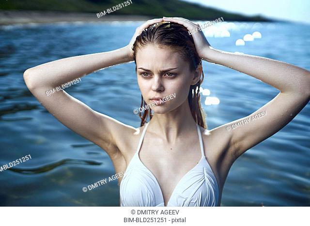 Serious woman wearing a bikini in ocean