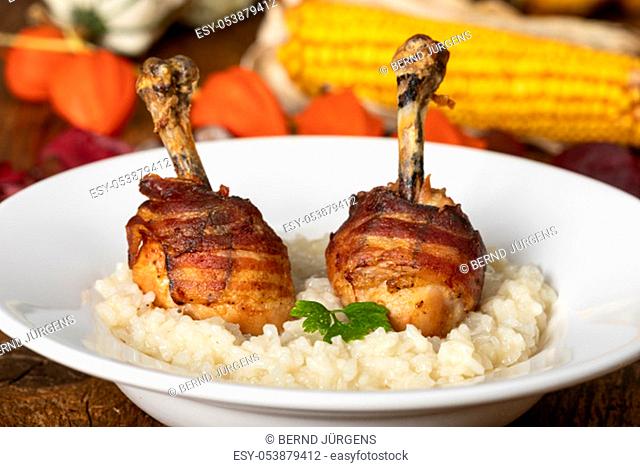 chicken legs with bacon on risotto