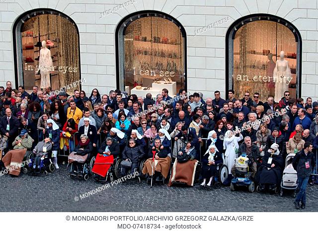 Crowd of believers participate in the traditional ceremony in honor of the Virgin Mary in Piazza di Spagna. Rome (Italy) Decembre 8th, 2019