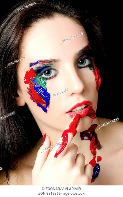 Beautiful woman with a paint on face