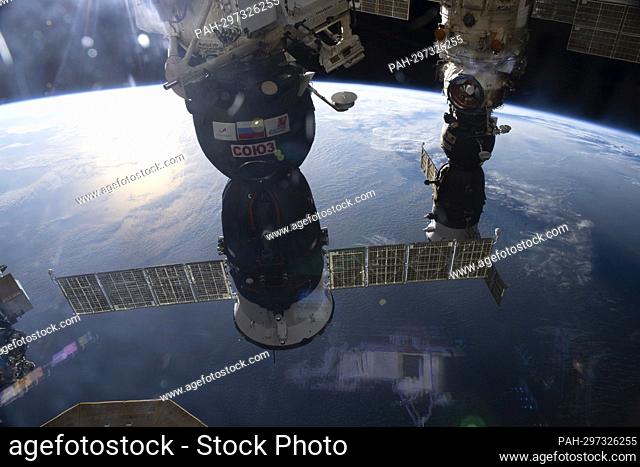 Two Soyuz crew ships are pictured docked at the International Space Station as it orbited 264 miles above the Indian Ocean in between Australia and Indonesia on...