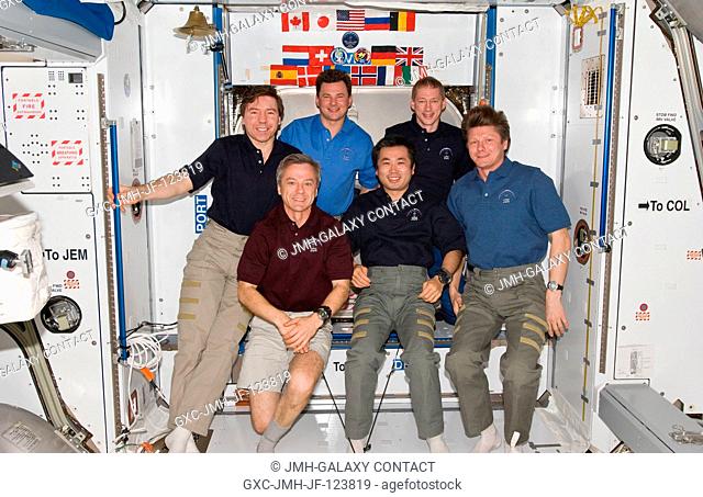 The six-person Expedition 20 crew poses for an in-flight portrait in the Harmony node of the International Space Station