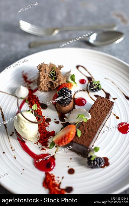Chocolate mousse with ice cream, blackberries and strawberries