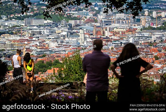03 September 2023, Baden-Württemberg, Stuttgart: People enjoy the view over Stuttgart in the sunshine at Santiago de Chile Square