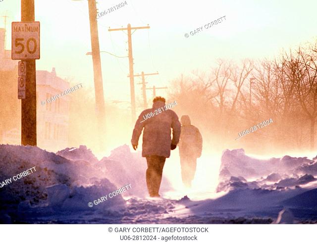 people walking on a cold winter day in blizzard conditions