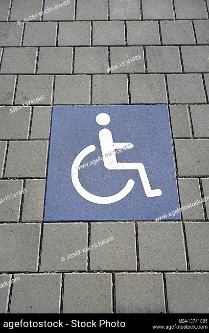 Germany, Bavaria, Altötting district, supermarket, parking space for the disabled, paved floor, wheelchair, symbol