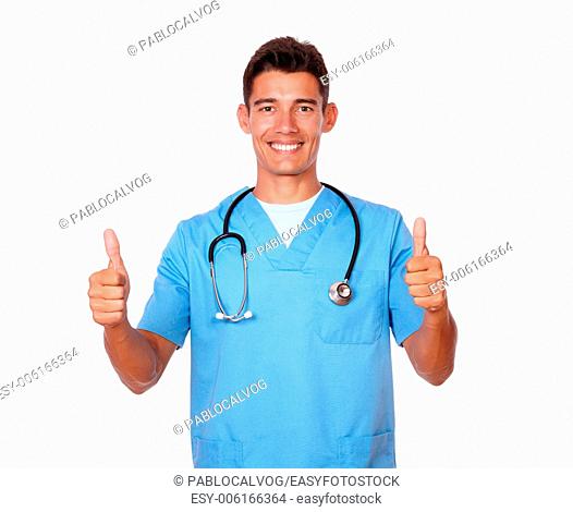 Portrait of a hispanic young nurse gesturing positive sign with fingers on white background