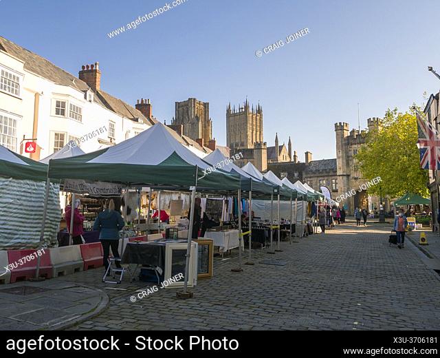 The bi-weekly market taking place at Market Place in the city of Wells with the cathedral in the distance, Somerset, England