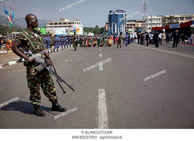 armed soldiers in front of a crowed of people during an event at the Independence Day Juli 1, Burundi, Bujumbura Marie, Bujumbura