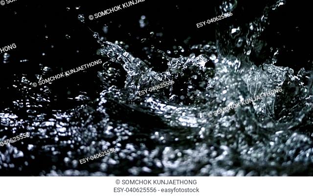 Water splash on black background color which represent clean and pure natural freshness of liquid for healthy drink or sparkling water