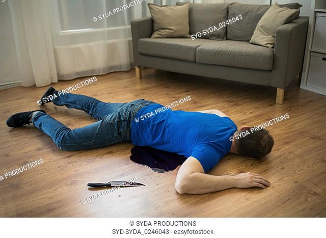 dead man body lying on floor at crime scene