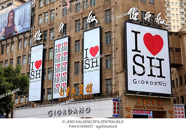 Large 'I love SH' ads by retail clothing trader Giordano on house fronts in Shanghai, China, 01 September 2015. Giordano International has its headquarters in...