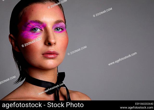 Close-up portrait of caucasian woman with creative make-up. High quality photo
