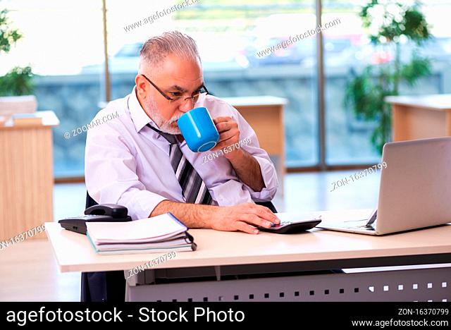 Old businessman employee unhappy with excessive work