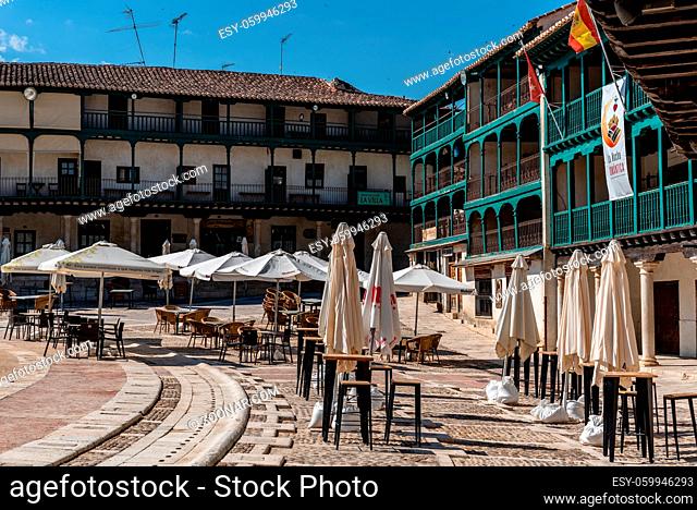 Chinchon, Spain - June 26, 2021: Plaza Mayor of Chinchon with terraces of typical restaurants. Central square of the town of Chinchon in Madrid