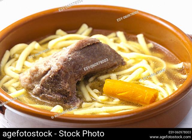 beef bouillon with carrot and noodles