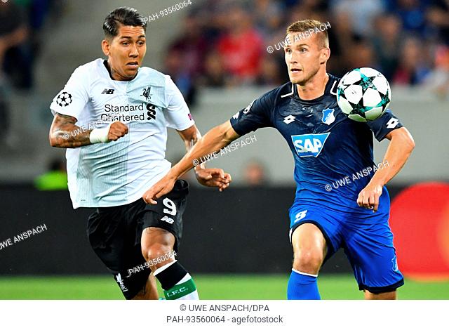 dpatop - Hoffenheim's Pavel Kaderabek (R) reachess the ball before Liverpool's Roberto Firmino during the Champions League's qualifer match between 1899...