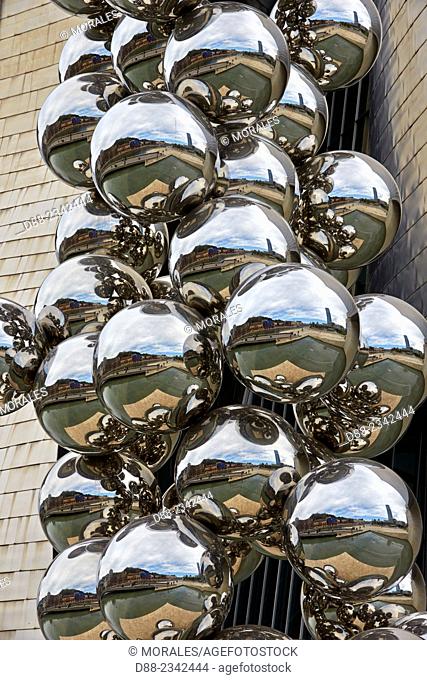 Europe, Spain, Basque country, Bilbao, Sculpture ""The Big Tree"" consisting of 80 stainless steel balls with reflections by Anish Kapoor in front of The...