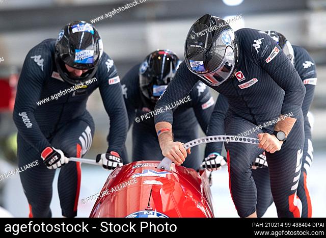 14 February 2021, Saxony, Altenberg: Bobsleigh: World Championship, four-man bobsleigh, men, 3rd run. Benjamin Maier, Danut Ion Moldovan
