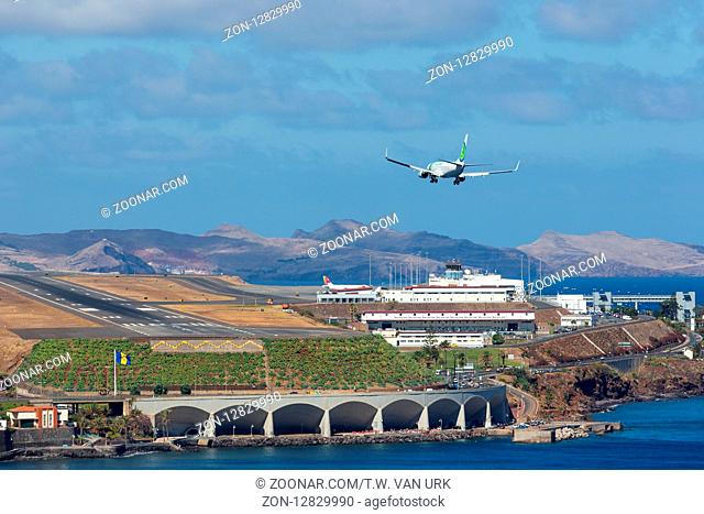 FUNCHAL, PORTUGAL - AUG 12: A Boeing 737 from Dutch airline Transavia is approaching Funchal Airport on Augustus 12, 2014 at Madeira, Portugal