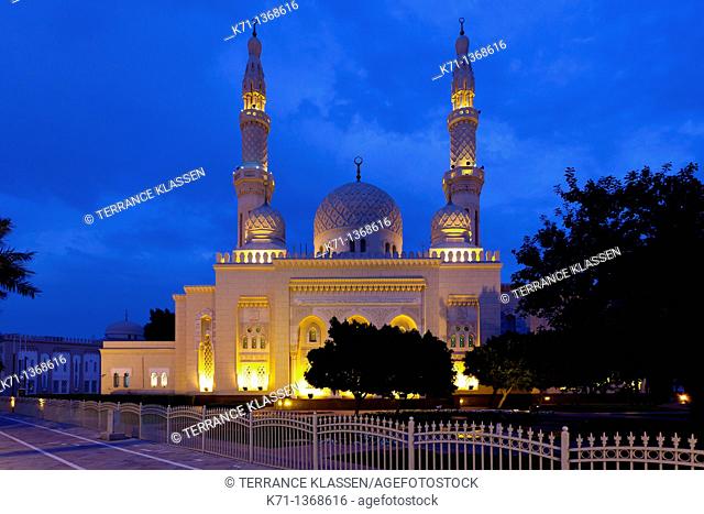 The Jumeirah Grand Mosque illuminated at night in Dubai, UAE