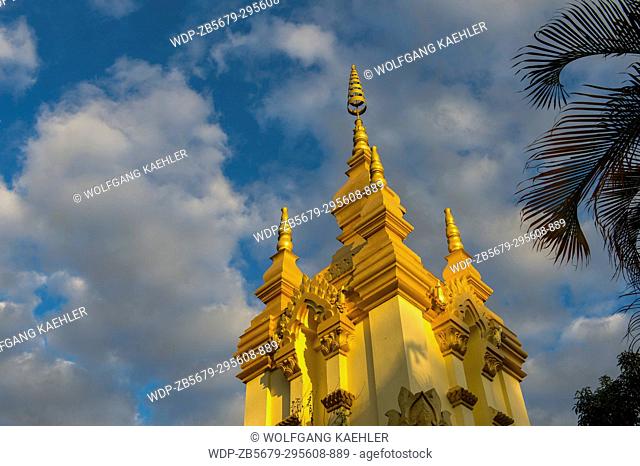 The evening light on the gilded stupa of Wat Prabat Tay (Wat Phra Bat Tai) in in the UNESCO world heritage town of Luang Prabang in Central Laos