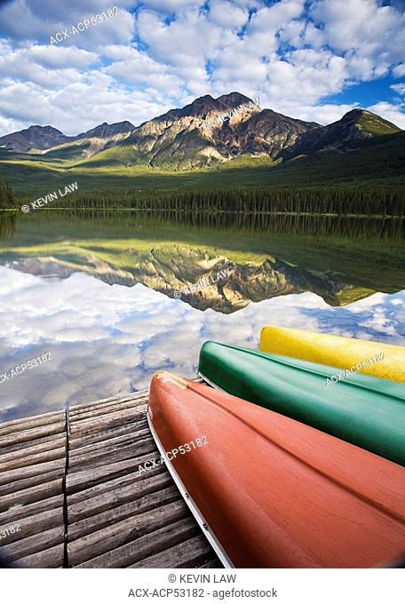 Three canoes on dock at Pyramid Lake, Jasper National Park, Alberta, Canada